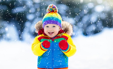 Boy standing in the snow