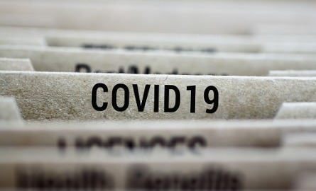 file folder with COVID-19 on it