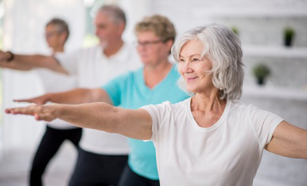 older adults practicing yoga