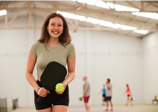 woman playing pickleball