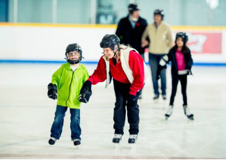 adults and children skatnig