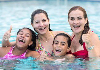 women and girls swimming in pool