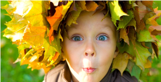 emotional boy with leaves surrounding him