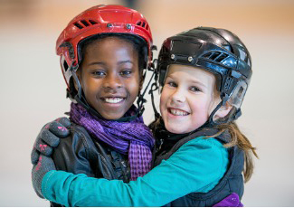 two kids with helmets