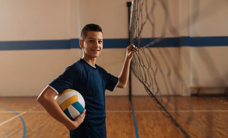 boy playing volleyball