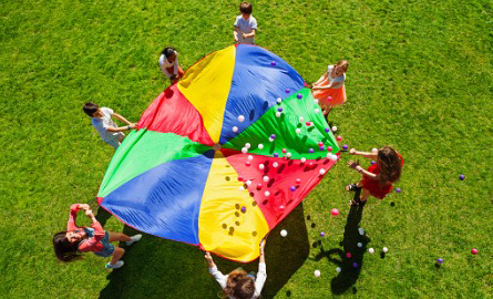 children playing with parachute outdoors