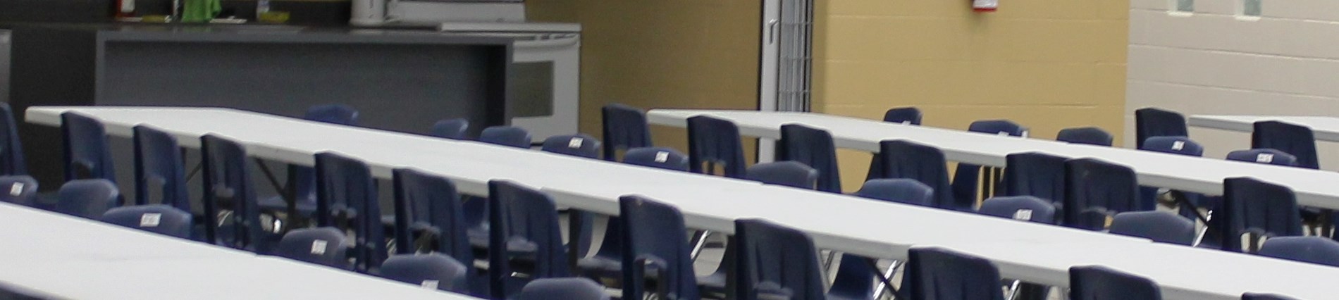 tables and chairs set up in multipurpose room