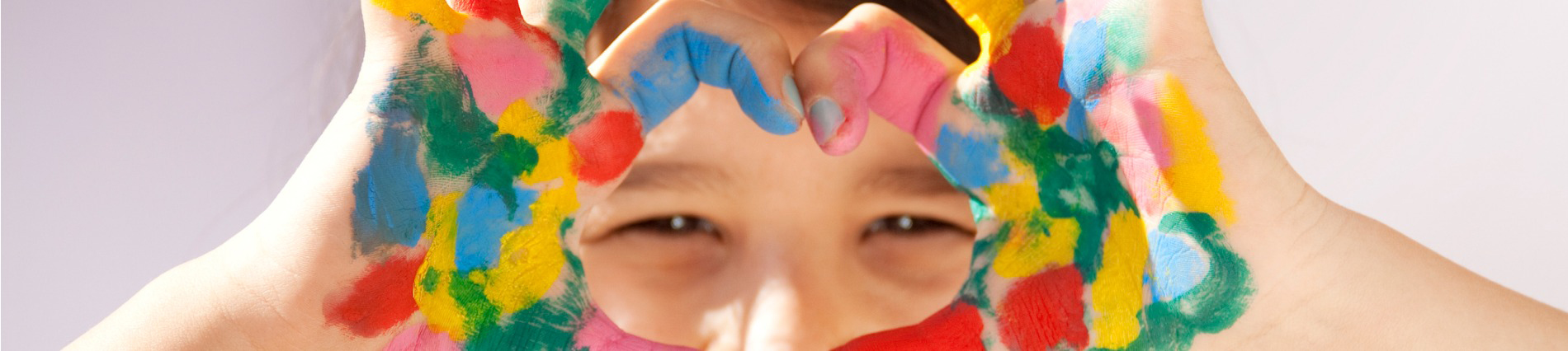 little girl with painted hands