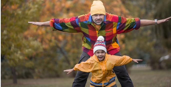 boy and father in the fall