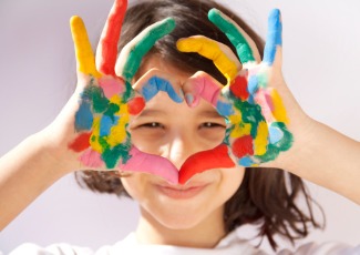 little girl with painted hands