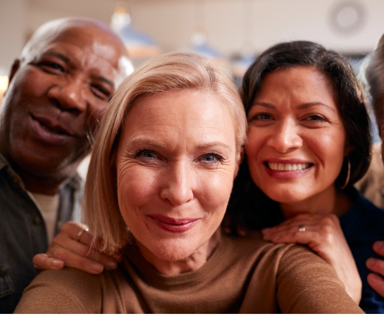 group of mature adults posing for selfie
