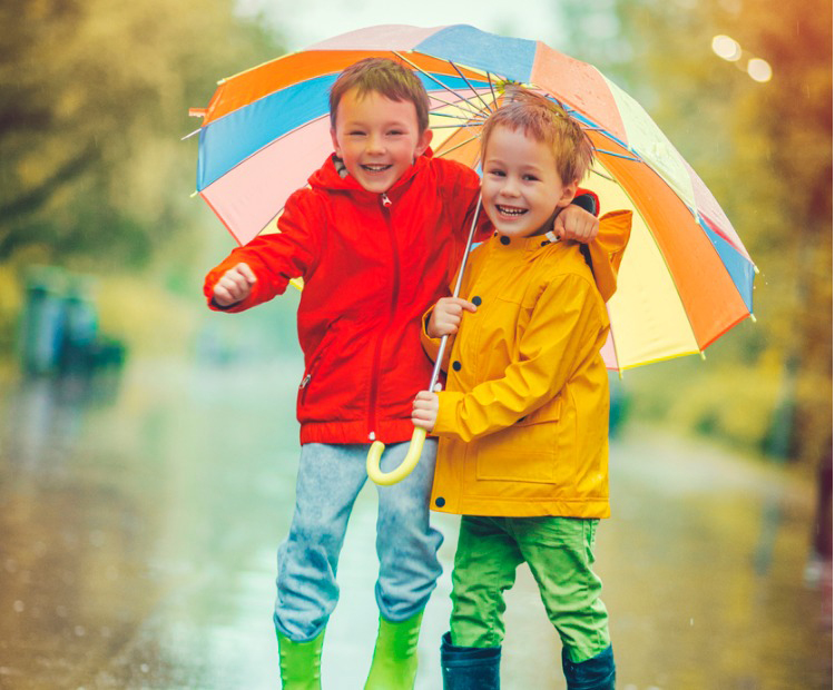 little boys in the rain
