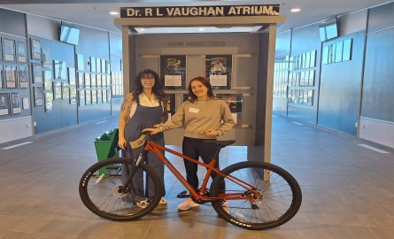 Councillor Chatten giving bike away to student winner